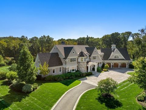 Situated on 7 acres, spanning almost 13,000 SF this custom-built architectural marvel integrates design, refinement & artistry. The meticulous millwork throughout sets the tone for unrivaled elegance. Step inside to a 2-story foyer w/ a barrel-vaulte...