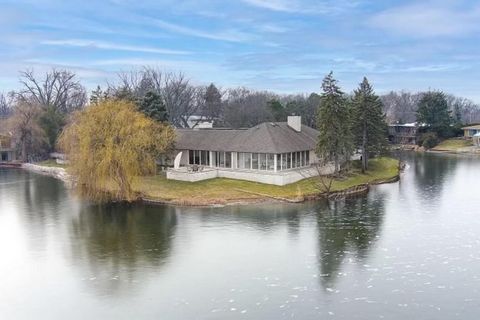 Presenting a one-of-a-kind 5,500 square foot residence, meticulously crafted from brick, limestone, steel, and glass. This distinguished home features four expansive suites, each with a private ensuite bathroom, totaling 4 1/2 luxurious baths. Perche...