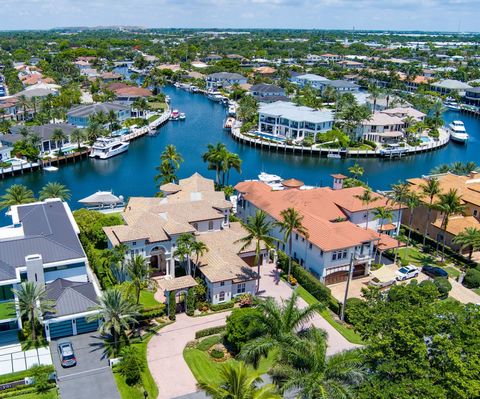 Ensconced in the yachting enclave of Lighthouse Point, this Deepwater Palazzo is a masterpiece sited on 101'+/- of waterfrontage at the confluence of the Kingfisher Waterway & Cap Knight Bayou with endless water views. A stone driveway creates a sens...