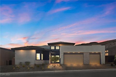 Nestled in the prestigious Mesa Ridge community of Summerlin, this exquisite single-story home embodies modern luxury and sophistication. From the grand entrance, you're welcomed into an expansive open floor plan bathed in natural light, perfect for ...