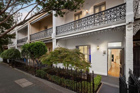 Amidst a row of historic balconied terraces on the edge of West Hawthorn village, this charming solid brick Victorian residence combines the proportions and elegance of the era with light-filled contemporary style. Baltic pine floors and high ceiling...