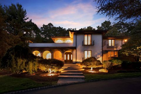 Welcome to 32 Apache Rd, a timeless Mediterranean masterpiece in Wayne, NJ's Indian Hill, near Pine Lakes. This architectural gem exudes character and history, boasting a ceramic tiled roof, stained glass windows, arch doors, white stucco walls, and ...