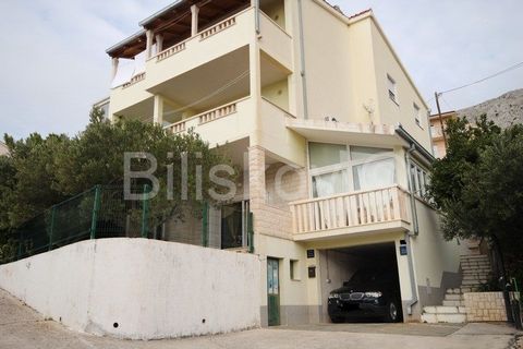 Omiš, Duće, semi-detached house near a beautiful sandy beach The house has a floor plan area of 140 m2, on a plot of 405 m2, on 4 floors, with a total living area of 400 m2, and it consists of 4 residential units. On the ground floor there is a garag...