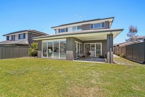 3 Olley Street, CLAYMORE A Custom design double storey Wisdom built home with Four generous size Bedrooms with Two bathrooms featuring high ceilings, downlights throughout the multiple living areas, and an abundance of natural sunlight on a generous ...