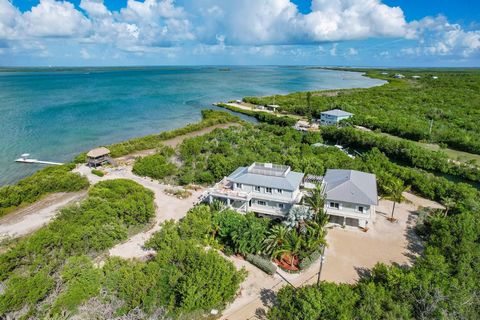 Perhaps the largest residential property in the Keys, this sprawling Big Torch Key estate offers a coveted 12+ acres and incomparable 2,000 ft of waterfrontage, with concrete dock, davits, and boat house! Unbeatable access to both the Atlantic and th...