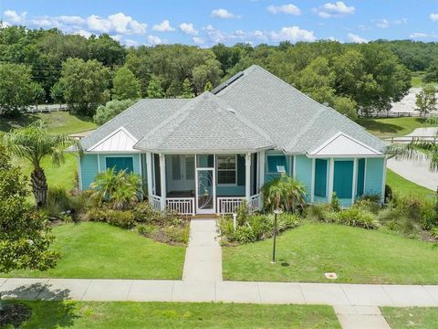 Welcome to this charming home located in the Green Key Village community inspired by the beauty of the Florida Keys, situated amidst serene wooded areas and conveniently close to The Villages. With solar electricity throughout, this net zero energy-e...