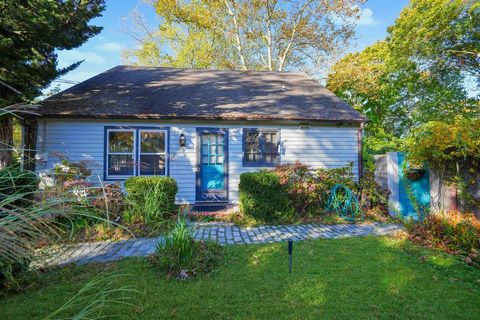 Discover a charming, recently renovated 2-bedroom, 2-bath retreat set on 0.34 acres, located just a mile from Sag Harbor Village. With 912 square feet of inviting living space, this home offers hardwood floors, central AC, and a full basement, seamle...