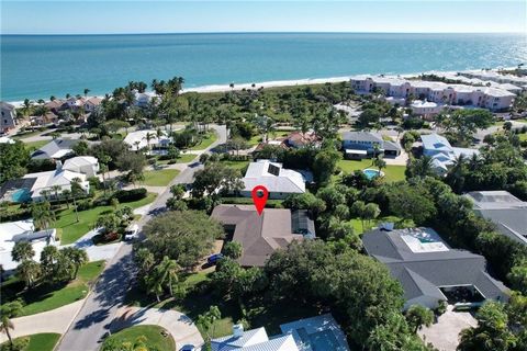 Steps From the Ocean! Just three houses from the private beach path in The Moorings, this home offers the perfect blend of luxury and convenience. Plantation shutters throughout, an exquisite chef’s kitchen & formal and casual living areas for added ...