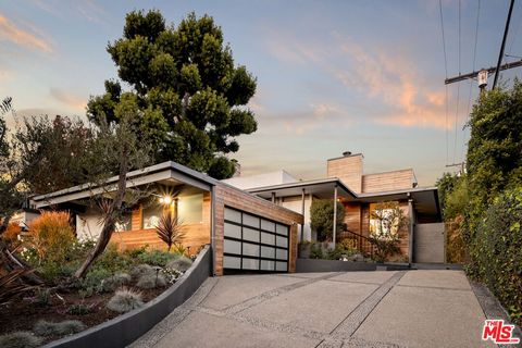 Located in the heart of Cheviot Hills, this stylish mid-century modern home offers timeless design with modern amenities. The light-filled open floor plan connects a chef's kitchen adorned with high-end finishes and custom cabinetry to a formal dinin...