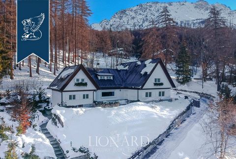 This recently-renovated luxury villa built in the 1950s for sale in the renowned skiing town of Cortina D'Ampezzo offers breathtaking views of the Dolomites and refined rooms with parquet floors, wooden walls and frescoed ceilings. This 1,000-sq...