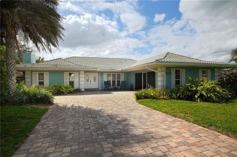 Embrace coastal luxury living in this River Walk gem, just a street from private beach access. Fully updated, it boasts a modern kitchen with a coastal flair, a heated crystal blue saltwater pool & spa, and a large sunroom, an added bonus for enterta...