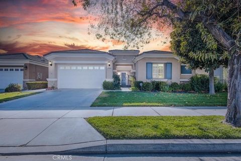 Nestled within a welcoming 55+ community, this exquisite home is a celebration of modern design paired with functionality. From the moment you approach the custom front gate, you'll be drawn into a serene patio setting that opens into both the main h...