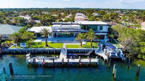 New, Gated Modern-inspired Intracoastal Estate sited on 161 feet of waterfrontage in no-wake zone facing the mega-mansions of Hillsboro Mile. Front Row views from this bespoke architectural masterpiece are encased in glass showcasing all major rooms ...
