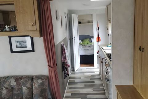The mobile home offers you enough space for a cosy stay. Perfect for families or groups. In the living area you will find a cosy seating area with TV. The two bedrooms have a double bed and two single beds for children. These and other amenities awai...