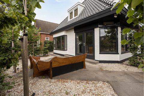 Stay in this modern holiday home in Drachten with your family for a fantastic vacation! The house has a well-furnished garden where you can start and end the days in style with a drink of your choice. The parking is 100 m away where you can safely pa...