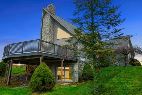 Discover this stunning 3500+ SF contemporary home, boasting 4 bedrooms, 4 baths, and a 2-car attached garage, nestled on a scenic 2.14-acre hillside lot with breathtaking country views. Featuring an open floor plan, this multi-level gem includes a ma...