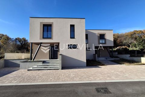 For sale is an extremely modern and high-quality project of a duplex house located in Labin, in a quiet location in a one-end street surrounded by greenery. The project consists of two two-story apartments, each with its own spacious garden. The ment...