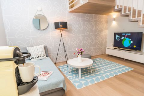 The stylish, homey boutique apartment offers space for 2 guests on a 55 squared meters space, with one double bed in a lovely gallery space. The designer bathroom features a shower, toilet is located across from it. A lovingly decorated living room h...