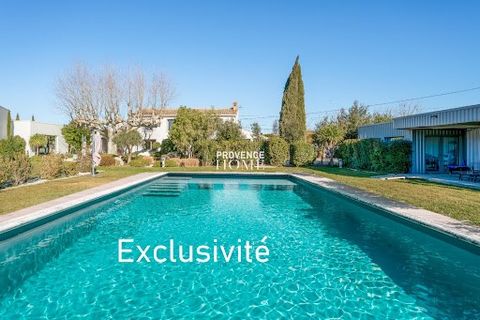 Provence Home, the Luberon real estate agency, is offering for sale, near L'Isle-sur-la-Sorgue, a high-end property with two separate entrances. It consists of a main farmhouse connected to a second dwelling, spacious outbuildings, and garages in per...