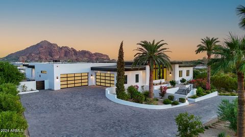 Experience this stately property with epic Camelback Mountain views, rare Downtown City Light views, and enormous Phoenix Mountain Preserve views; offering a stunning single level main residence, attached guest house, and a detached guest casita. Thi...