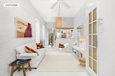 Discover this rare East Village studio with loft like ambiance and garden access. This studio is so much more with its ability to convert easily to a one bedroom. Showcasing stunning nearly 12' high ceilings, excellent storage space and in-unit washe...