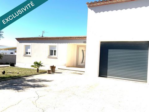 Maison T4 de 120m2 sur parcelle de 1124m2 en zone artisanale avec Hangar attenant .