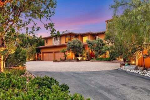 Stunning Tuscan inspired estate located in the exclusive gated community of Double LL Ranch. Nestled in a quiet cul-de-sac surrounded by natural open space and beautiful rolling hills, country views and ocean breezes. Expansive 2.1 acres of usable gr...