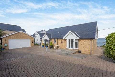 Built in 2012, this bespoke bungalow was commissioned by its current owners to perfectly align with their needs. Situated atop a substantial corner plot, it occupies a unique position as the sole beachside bungalow affording uninterrupted, awe-inspir...