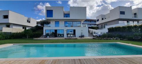 Fabulous 5+1 bedroom villa for sale, with swimming pool, in Serra de Carnaxide, Lisbon House located on a plot of 1000m2. Luxury Finishes. This villa has the following composition: Floor 0: - Living room and dining room with access to a huge balcony ...