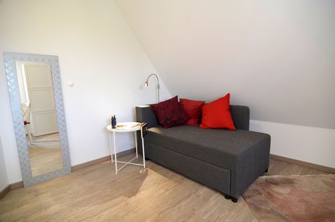 In the middle of Seulberg, a district of Friedrichsdorf, centrally located in the traffic-calmed town centre, lies this beautifully renovated apartment. It is located in the attic of a modern house, which was built in the style of a historical half-t...