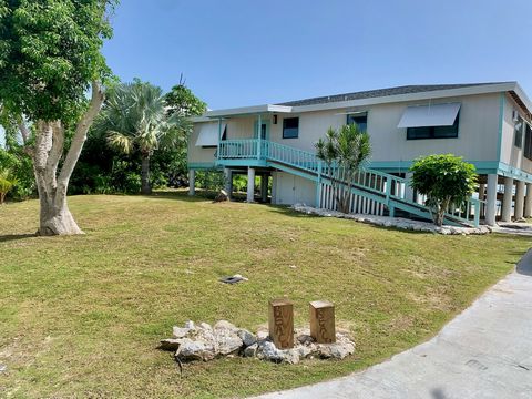 Yachters Haven with Beachfront Home the best of both worlds! The Canal Lot can accommodate up to a 65--- yacht boat and is just across the street from our Beachfront Home ---Beach Reach---. This three bedroom, two bath, 1,700 square foot home is loca...