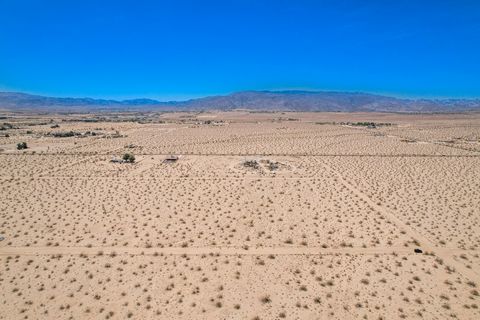 Opportunity to own land and build the home you've always wanted with panoramic desert and breathtaking distant mountain views. 2.29 acres of flat, buildable land just one block in & a few blocks over from major roads, Indian Trail and Adobe Rd. Lot b...
