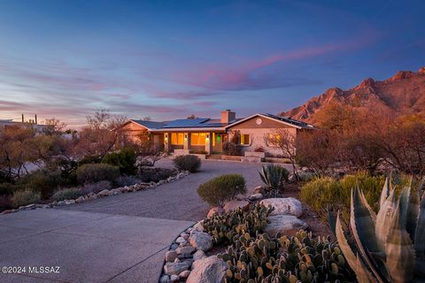 SELLER OFFERING $10K toward Interest Rate Buy Down or Updates! Nestled at the Top of the Hill near Pima Canyon, is this Perfectly Sited .83 Acre Desert Dweller's Dream Home with Solar + Rain Water Harvesting. Front Porch w/Sunset & City Light Views! ...
