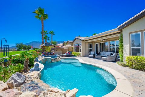 This elegant single-level Anise design home in the prestigious Trilogy community offers stunning views along the #5 fairway of the golf course, with mountains and desert as the backdrop. The private oasis's backyard features a Pebble-Tec pool, cascad...