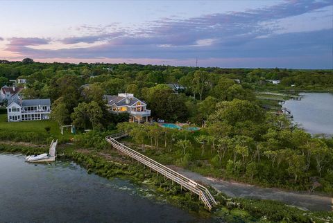 Situated on a picturesque quiet peninsula overlooking Shinnecock Bay all the way to the Ocean, this unique and very private 1.6 acre property has been just upgraded and renovated, including a brand-new full Chefs kitchen on the first floor, plus a ne...