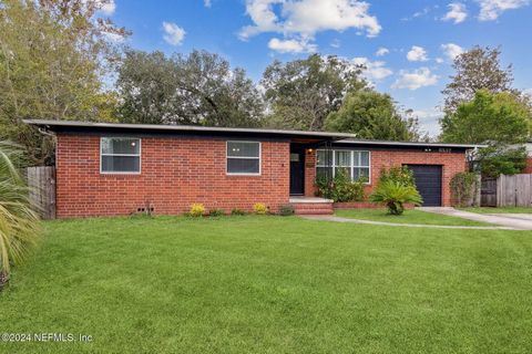 Great 3/2 brick 1958 Ranch home w 2 car garage and large yard. Gorgeous wood floors, many original features in this Mid Century gem- including the original 1950's wood cabinets and classic 'Boomerang' countertops and backsplash for the ultimate retro...