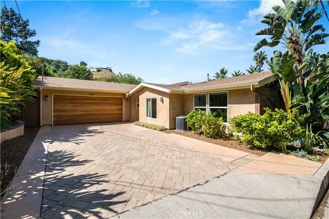 Tucked away on a quiet street in the hills of Sherman Oaks resides this beautifully updated single-story home. Step inside to find a charming open-concept main living space that boasts soaring vaulted ceilings and a wall of windows that bathe the int...