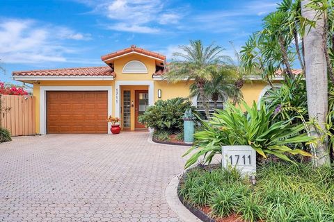 Welcome to your tropical oasis in Fort Lauderdale! This meticulously maintained home has been lovingly cared for by the same owner for 25 years. Step into a lush paradise as you explore the front and back yards, each designed to provide a serene esca...