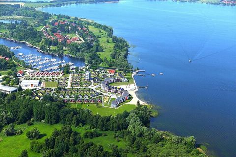 This inviting apartment for four guests is nestled in a peaceful holiday park directly on the shores of Müritz, Germany’s “Little Sea.” With two bedrooms, a bathroom, and a kitchen, it’s ideal for families or small groups seeking a nature-filled esca...