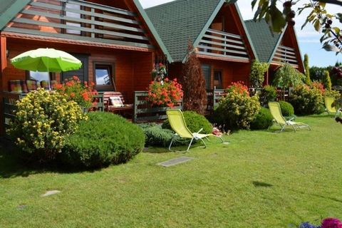 On a fenced property, 400 m from the sea, a few steps from the center of the town, a family holiday resort with attractive infrastructure awaits. Two-storey holiday houses. On the ground floor there is a living room with a double sofa bed, a table an...